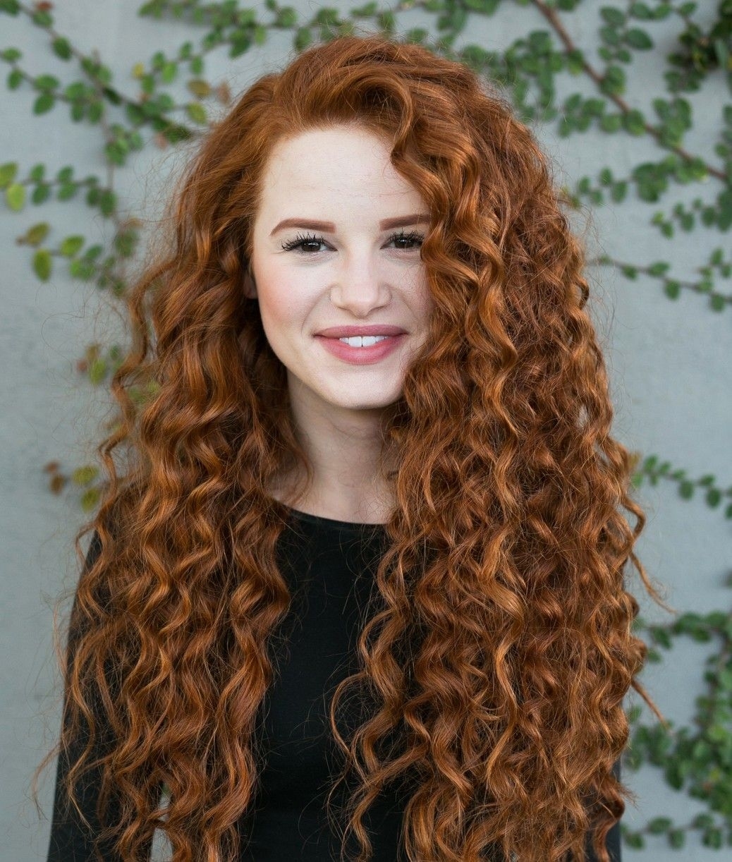 Ling curly red hair style sitting atop a woman's head